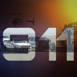 Emergency vehicles in the background with a 911 superimposed.