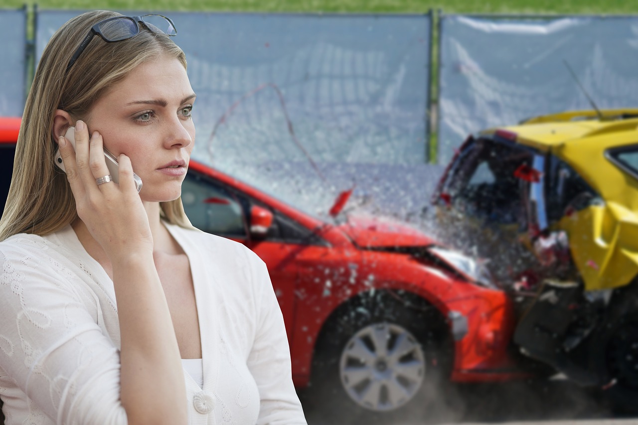 Woman calling 911 for help after a car accident.
